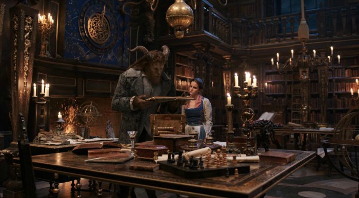 Movie still of the Beast and Belle in the Beast's study from the 2017 film version of Beauty and the Beast.
