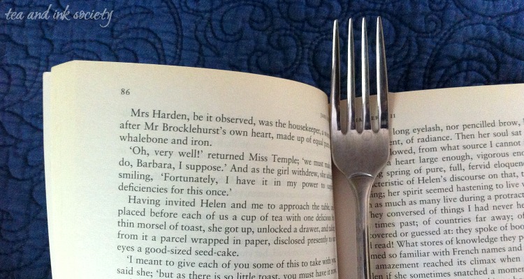 Open copy of Jane Eyre with a fork bookmark