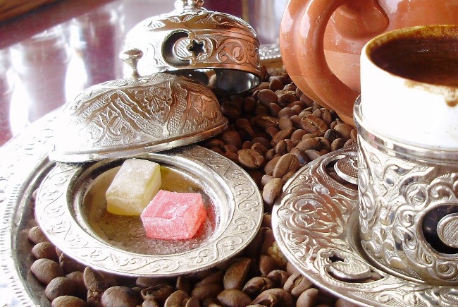 Turkish delight cubes and Turkish coffee on silver dishware