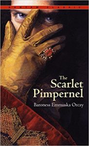 Book cover for The Scarlet Pimpernel by Baroness Orczy - Man in fancy clothes peeking out from behind gloved hand