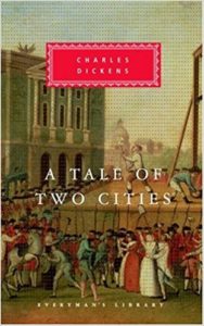 Book cover of A Tale of Two Cities by Charles Dickens - city scene of the French Revolution, with guillotine