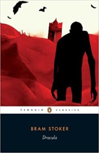 Book cover of Dracula by Bram Stoker - silhouette of monstrous figure stumbling out of a red background with red castle and black bats