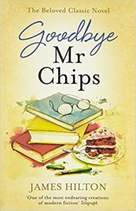 Book cover of Goodbye, Mr. Chips - glasses on top of a stack of books, with slice of cake nearby