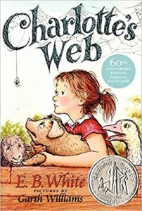 Book cover of Charlotte's Web, with Garth Williams illustration of Fern and farm animals looking at Charlotte the spider