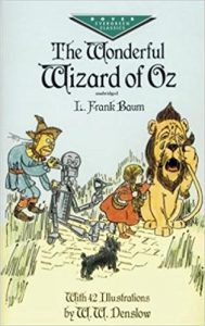 The Wizard of Oz book cover - Dorothy and friends on the yellow brick road.