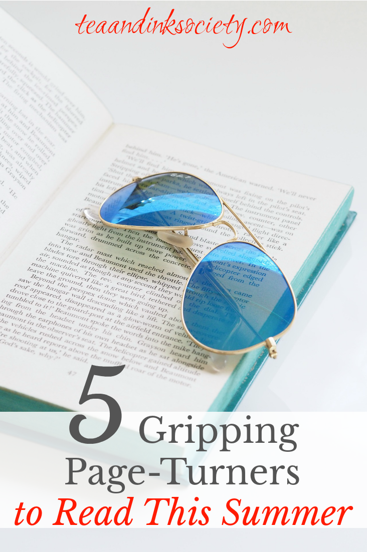 Pair of blue-lens sunglasses on an open book