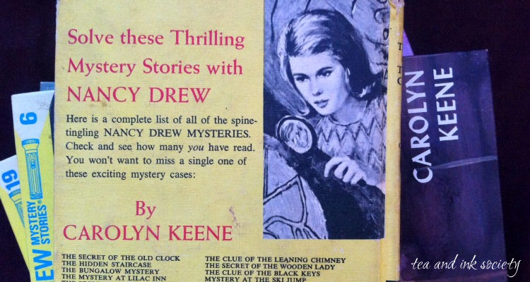 Stack of yellow hardback Nancy Drew books, showing the back cover