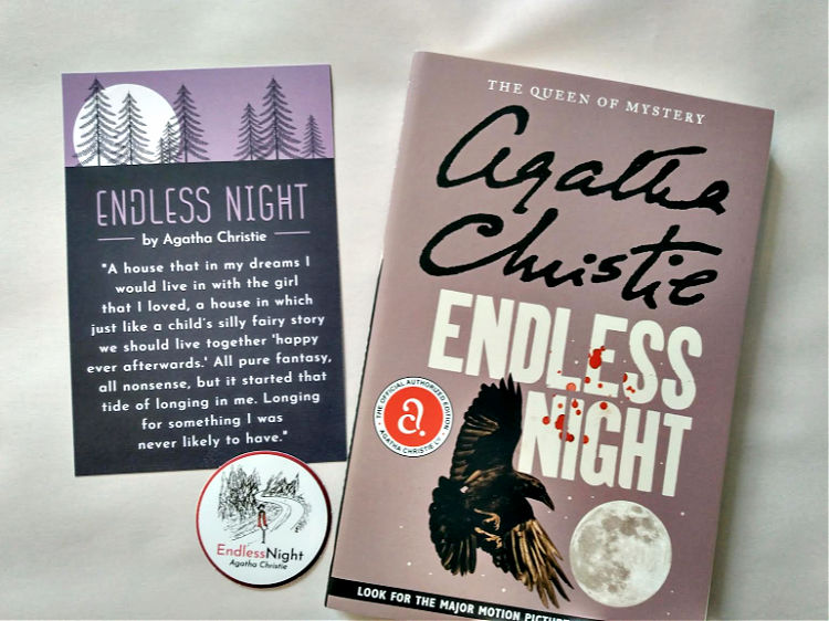 Paperback copy of Endless Night with coordinating postcard and sticker