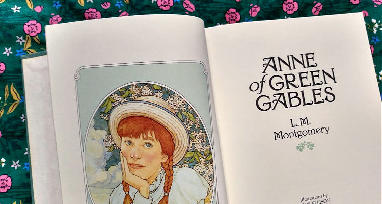 Open Anne of Green Gables book with title page and picture of Anne Shirley