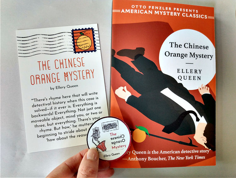 Paperback copy of The Chinese Orange Mystery with coordinating postcard and sticker