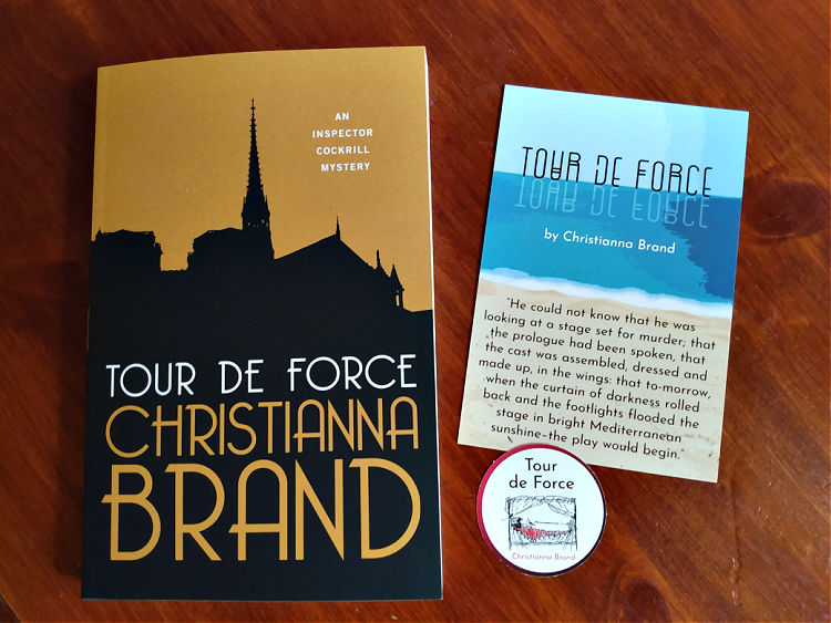 Paperback copy of Tour de Force by Christanna Brand, with artistic postcard and sticker