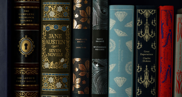Row of beautiful hardcover classic books on a shelf