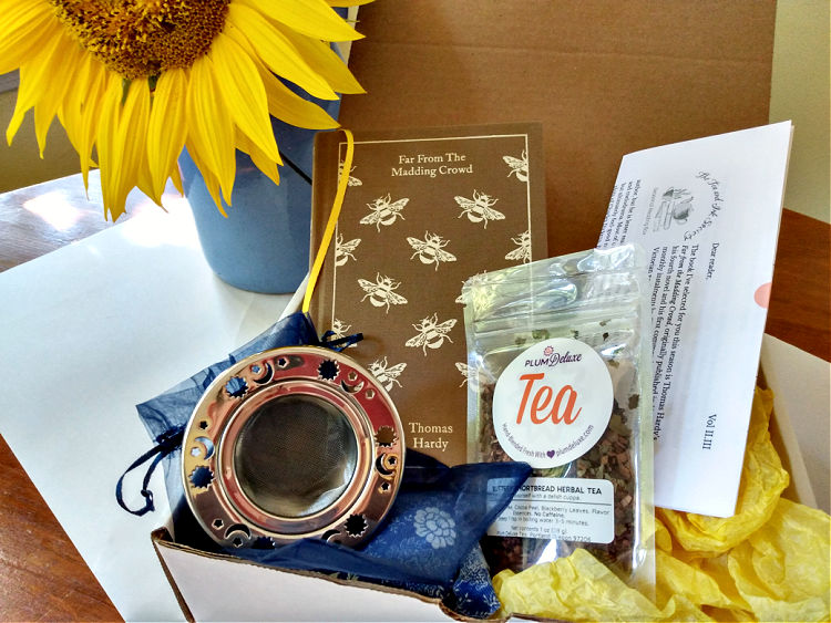 Book subscription box including celestial-themed tea infuser, Penguin clothbound edition of Far from the Madding Crowd, and bag of looseleaf tea