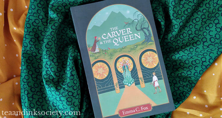 Copy of The Carver and the Queen novel, with green, jewel-toned cover art